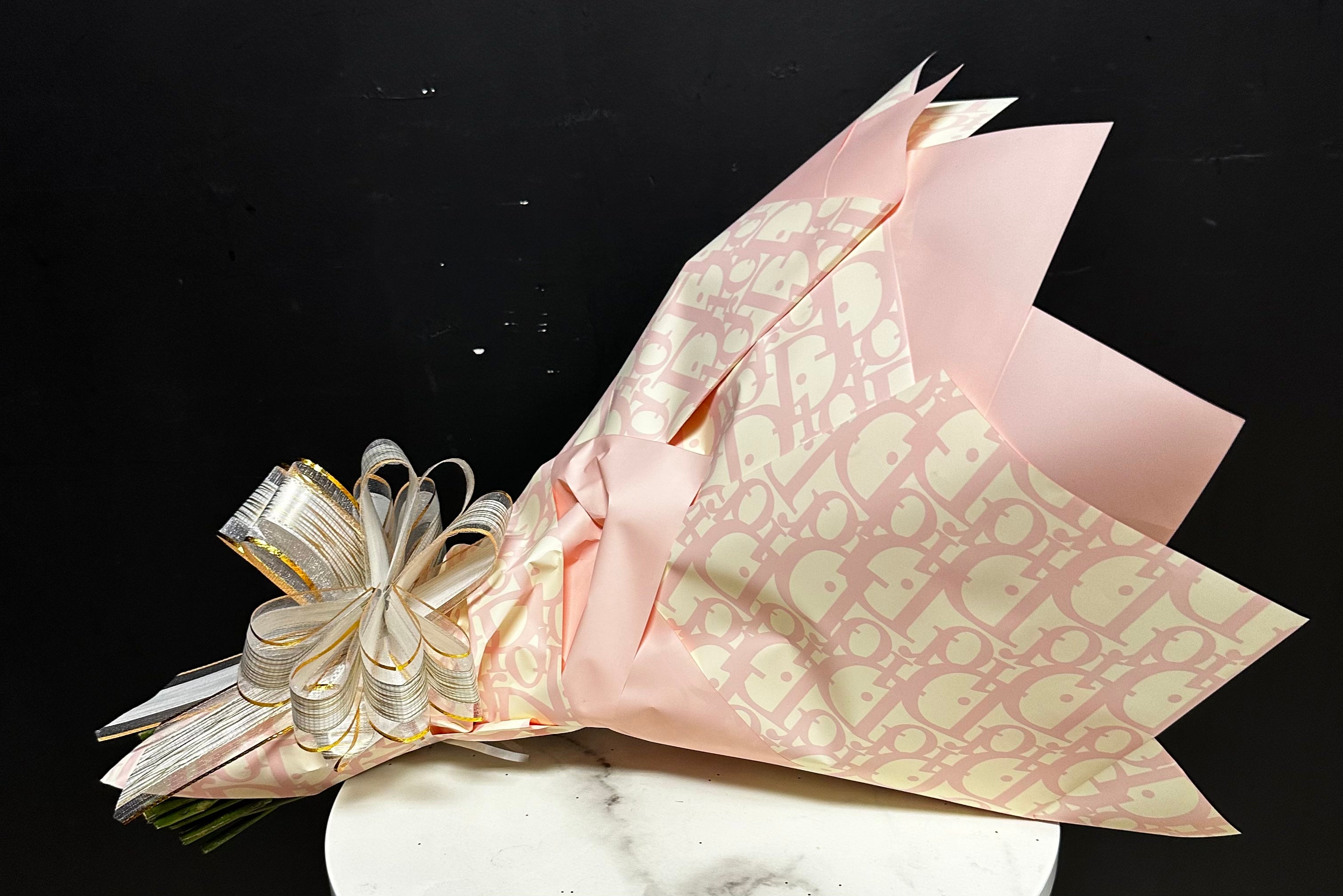 Houston Tx. Florist🌹 on Instagram: Elevate your gift-giving experience  with our luxurious crafted wrapping paper featuring stunning Dior-inspired  floral designs. • • • #florist #flores #floral #floralarrangement #florals  #floraldesign #rosebouquet
